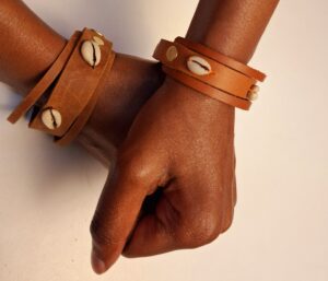 Unique, stylish and artistic genuine leather bracelet accessorized with shells.