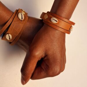 Unique, stylish and artistic genuine leather bracelet accessorized with shells.
